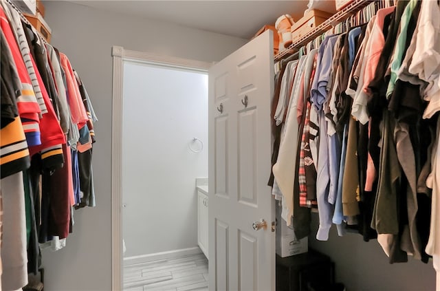 spacious closet featuring light hardwood / wood-style floors