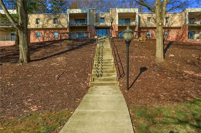 view of front of house featuring a balcony