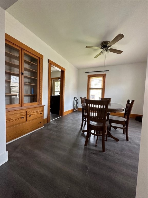 dining room featuring plenty of natural light, built in features, and ceiling fan