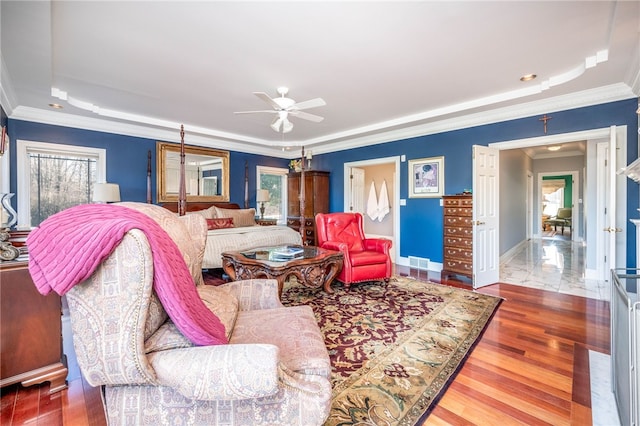 living room with ceiling fan, crown molding, and dark wood-type flooring