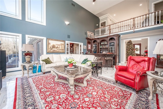 tiled living room with a high ceiling