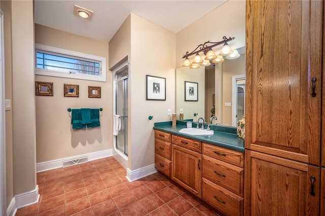 bathroom with tile floors, a shower with door, and oversized vanity