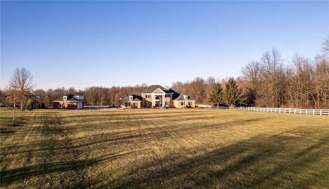 view of yard with a rural view