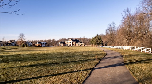 view of property's community featuring a yard