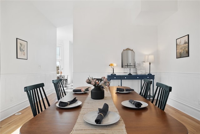 dining space with light hardwood / wood-style flooring