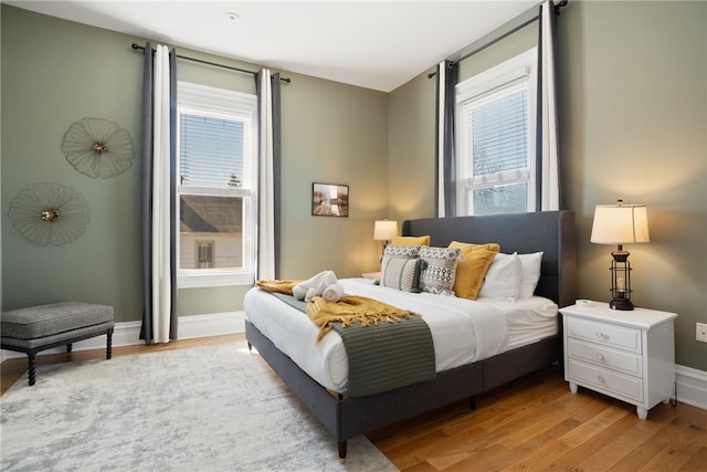 bedroom with light hardwood / wood-style floors