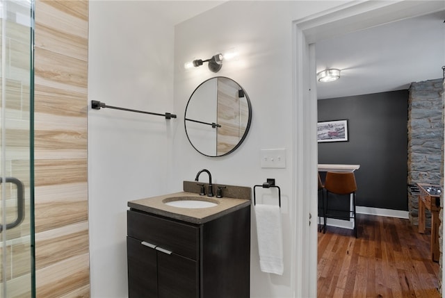 bathroom featuring wood-type flooring and vanity