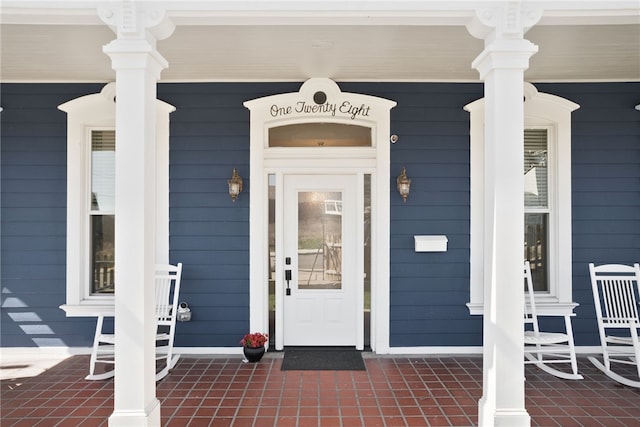 entrance to property with a porch