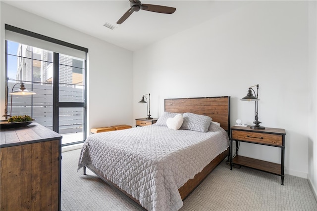 bedroom featuring ceiling fan and light colored carpet