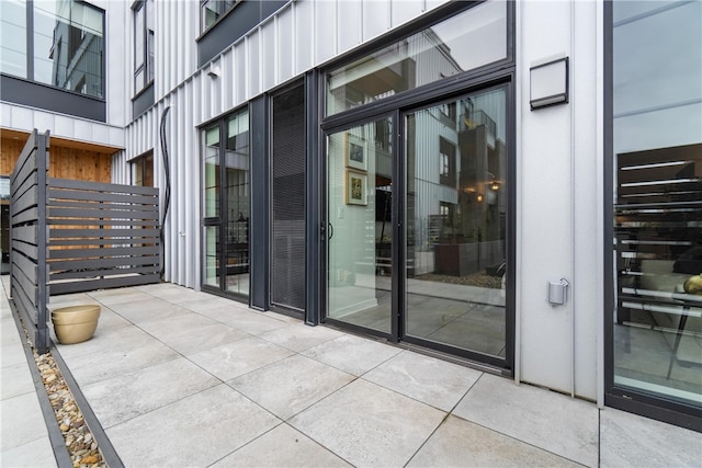 property entrance with a patio area