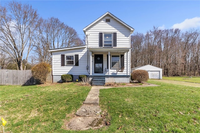 view of front of property featuring an outdoor structure, a porch, a front lawn, and a garage