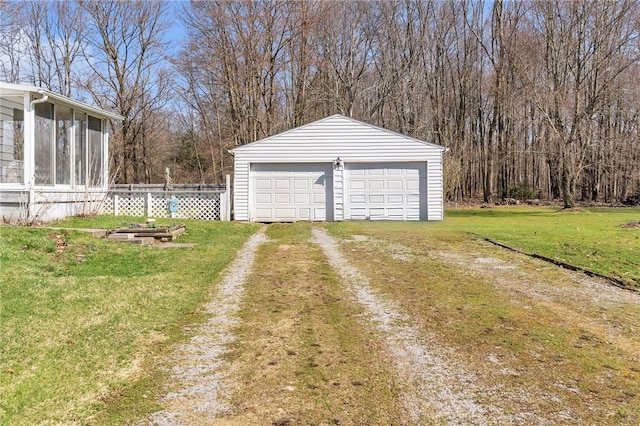 garage featuring a lawn