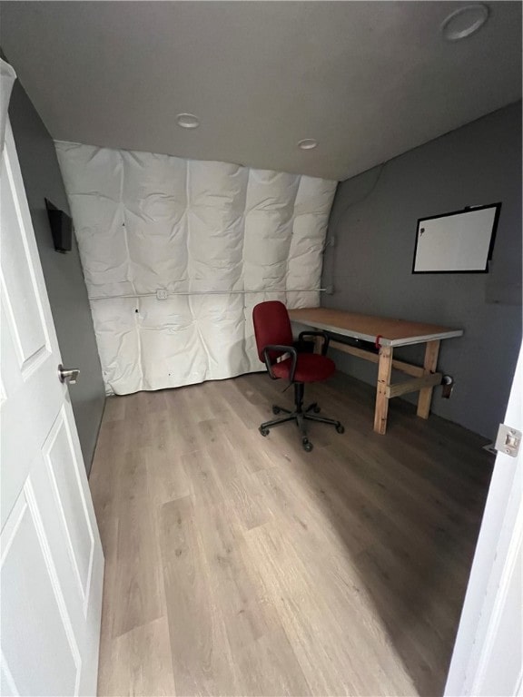 office area with light hardwood / wood-style floors