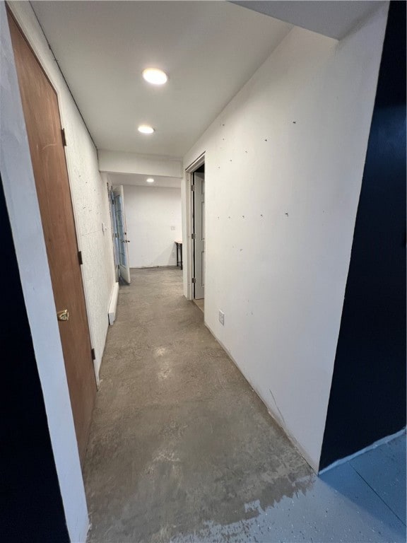 corridor with concrete flooring