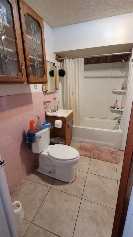 full bathroom featuring shower / bathtub combination with curtain, tile flooring, toilet, and vanity