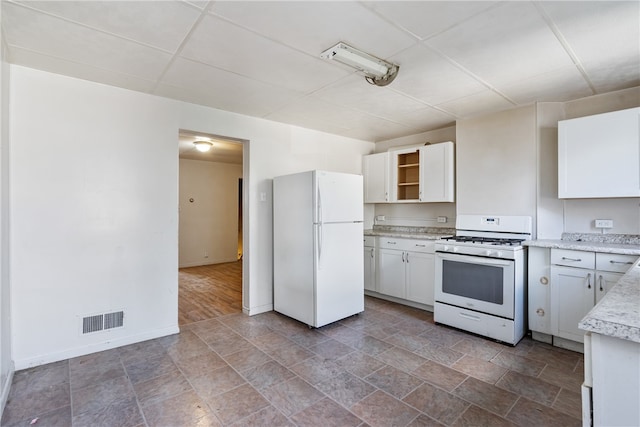 kitchen with white cabinets and white appliances