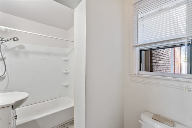 full bathroom featuring toilet, shower / bathtub combination, and vanity