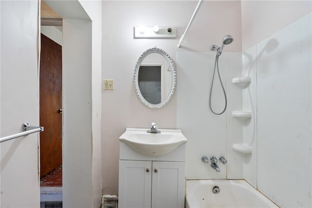 bathroom featuring vanity and washtub / shower combination