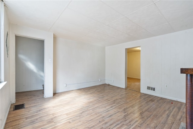 unfurnished room with light wood-type flooring