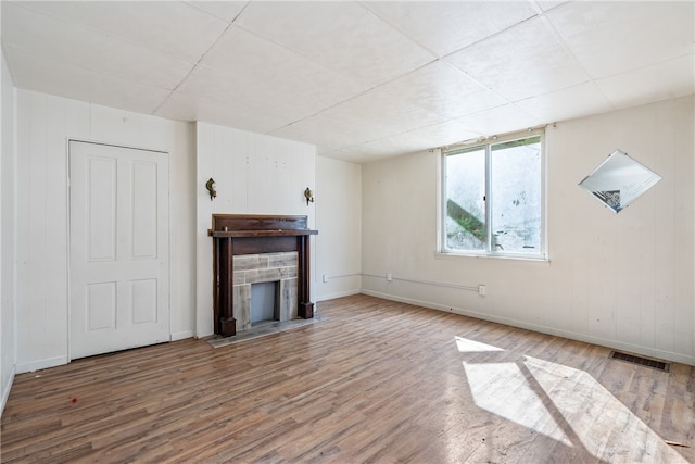 unfurnished living room featuring wood-type flooring