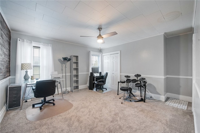 office featuring ceiling fan, ornamental molding, and light colored carpet