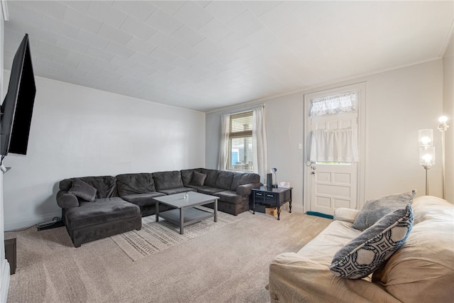 living room with crown molding and light colored carpet