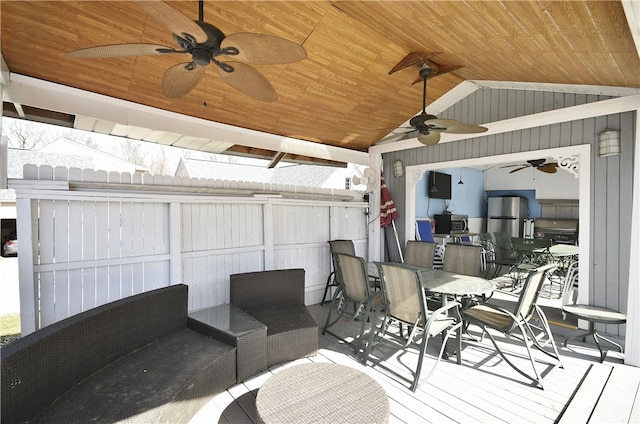 exterior space with vaulted ceiling, ceiling fan, and wooden ceiling