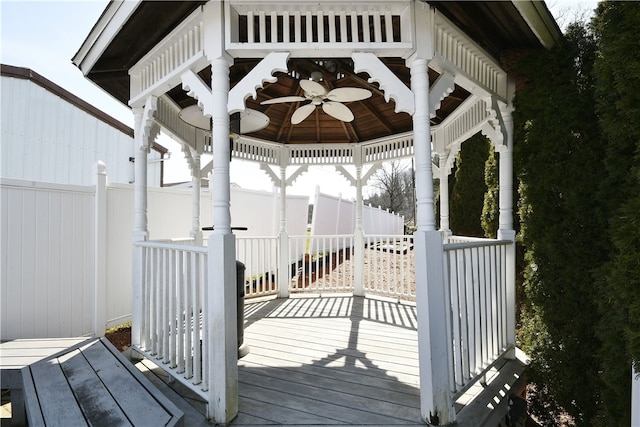 deck featuring ceiling fan and a gazebo