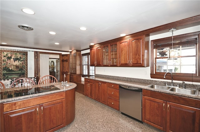 kitchen with decorative light fixtures, sink, and stainless steel dishwasher