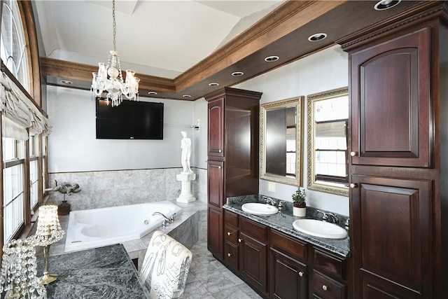 bathroom with plenty of natural light, double vanity, a notable chandelier, and a relaxing tiled bath