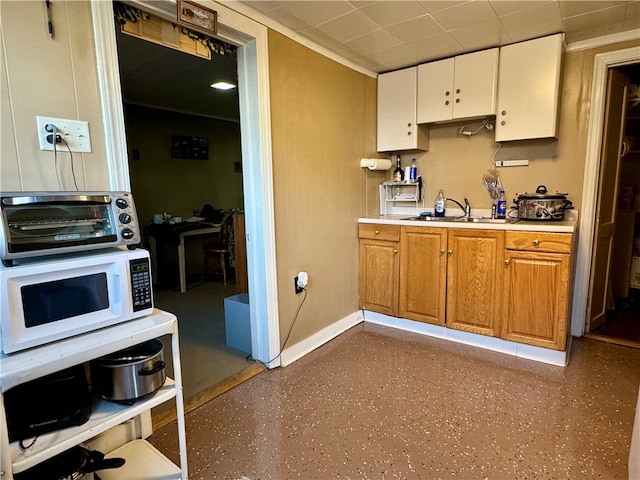 kitchen with white cabinets and sink