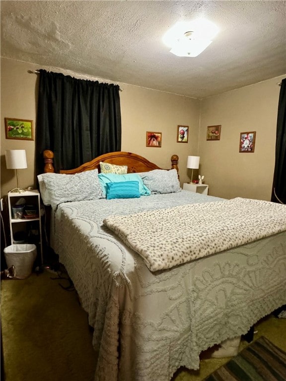 carpeted bedroom featuring a textured ceiling