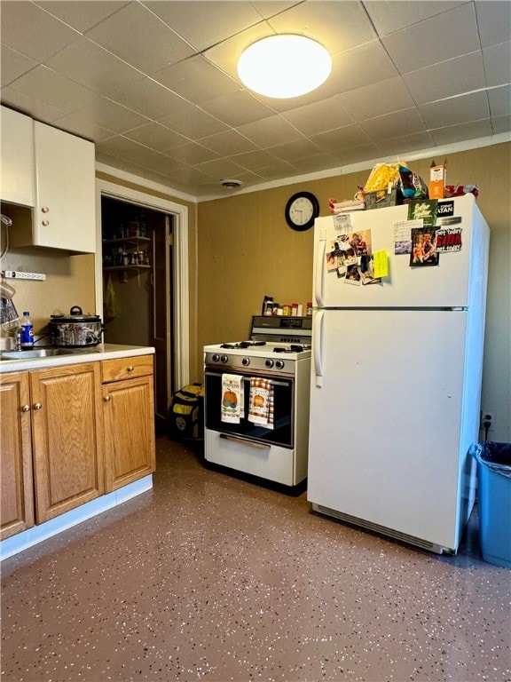 kitchen featuring sink and white appliances