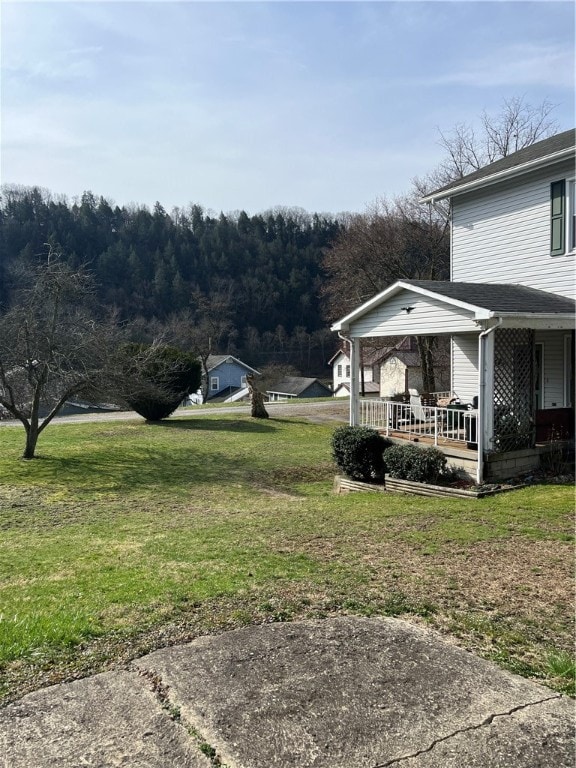 view of yard with covered porch