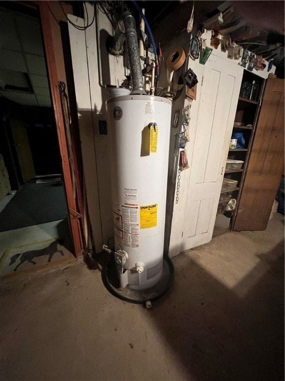 utility room featuring gas water heater