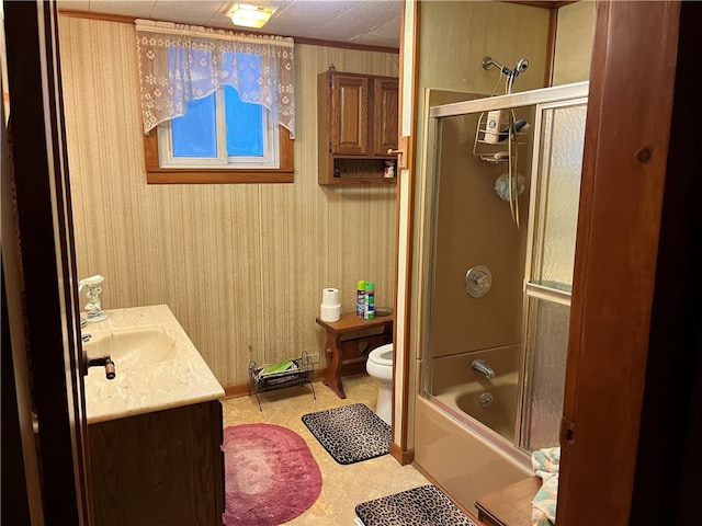 full bathroom with vanity, tile floors, a drop ceiling, toilet, and shower / bath combination with glass door