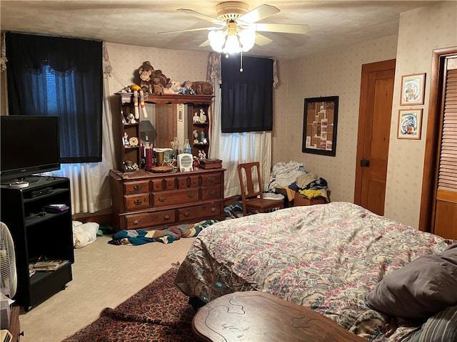 carpeted bedroom with ceiling fan