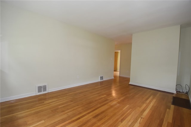 spare room with light hardwood / wood-style flooring