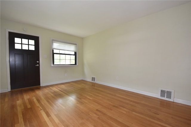 foyer entrance with light wood-type flooring