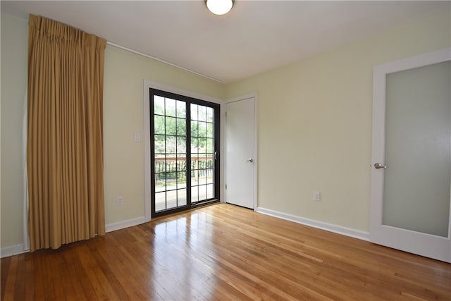 spare room with light hardwood / wood-style flooring