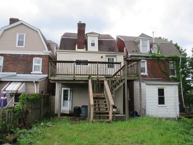 rear view of house featuring a deck