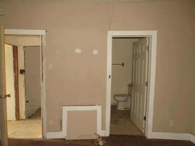 unfurnished bedroom featuring ensuite bathroom