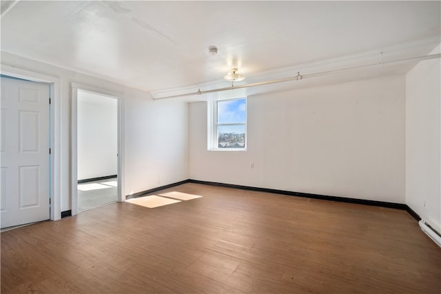 empty room with dark hardwood / wood-style floors