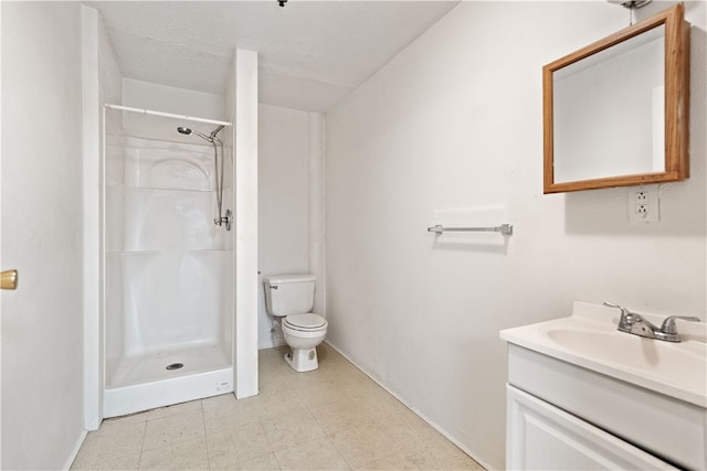 bathroom with a shower, toilet, vanity, a textured ceiling, and tile floors