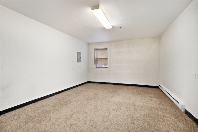 carpeted spare room with baseboard heating