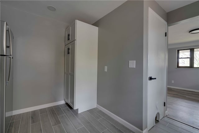 corridor with dark wood-type flooring