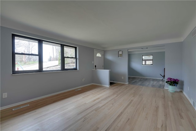 empty room with light wood-type flooring