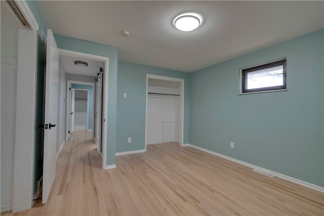 unfurnished bedroom featuring light wood-type flooring