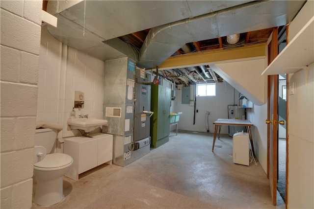 basement featuring sink and electric water heater