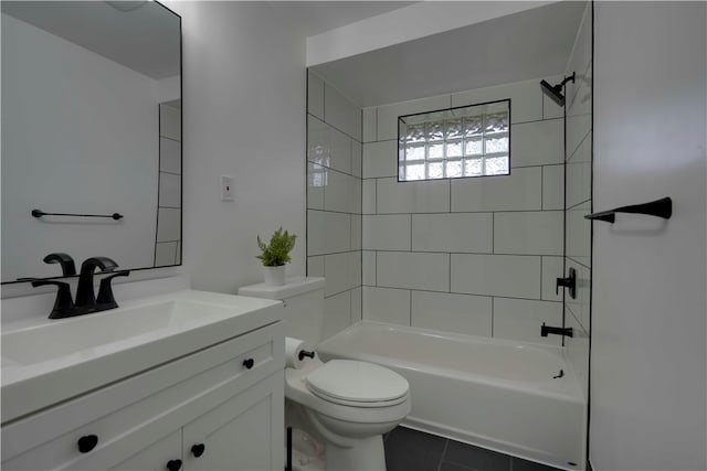 full bathroom with tiled shower / bath combo, vanity, tile floors, and toilet